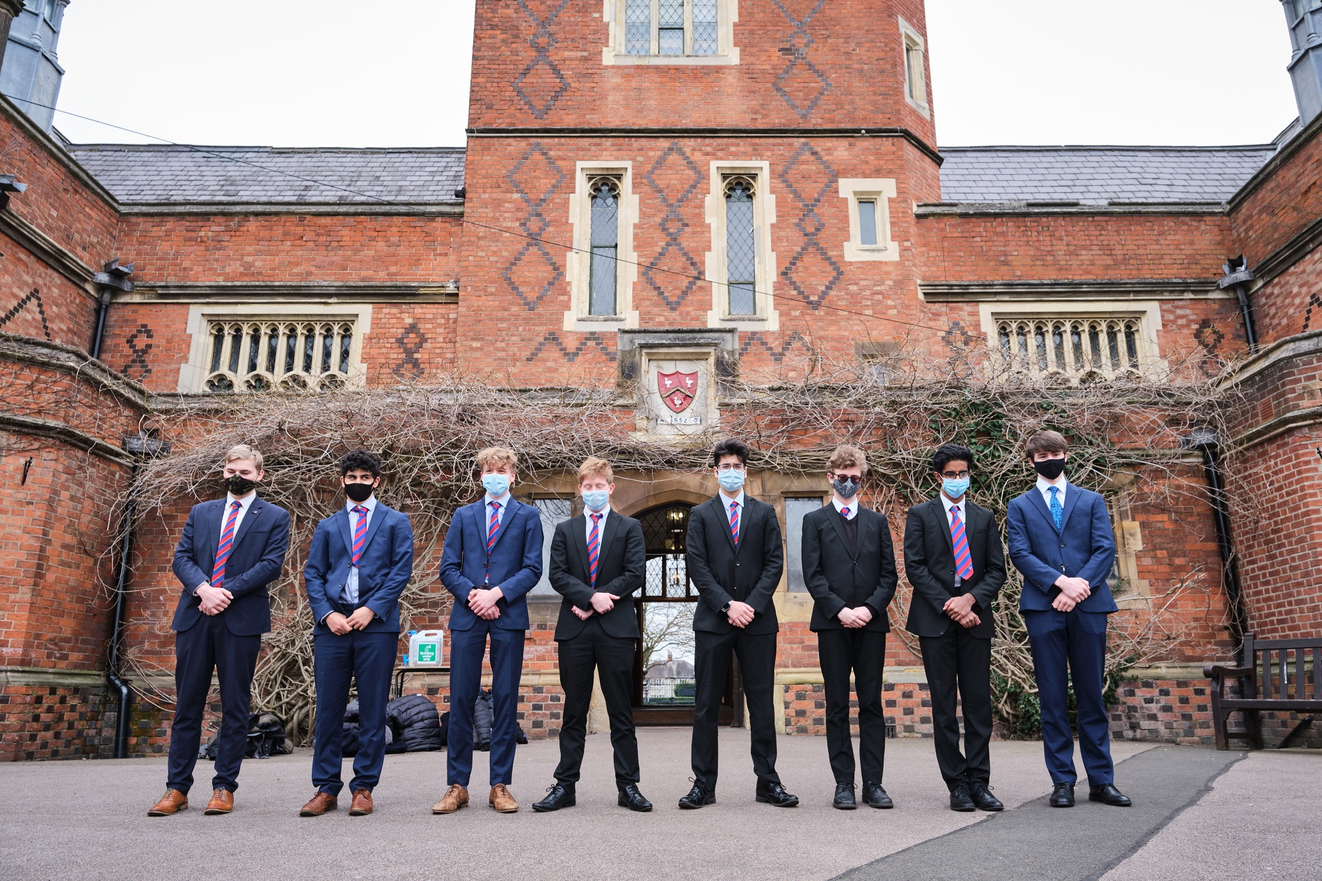 Grammar School students observe minute silence to mark a year since Covid lockdown